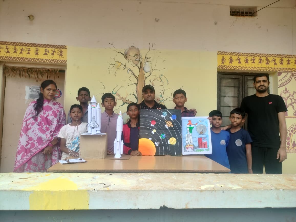 Students and teachers with science project models at the EMRS Ananthagiri science fair